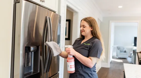 Team Member Cleaning Fridge